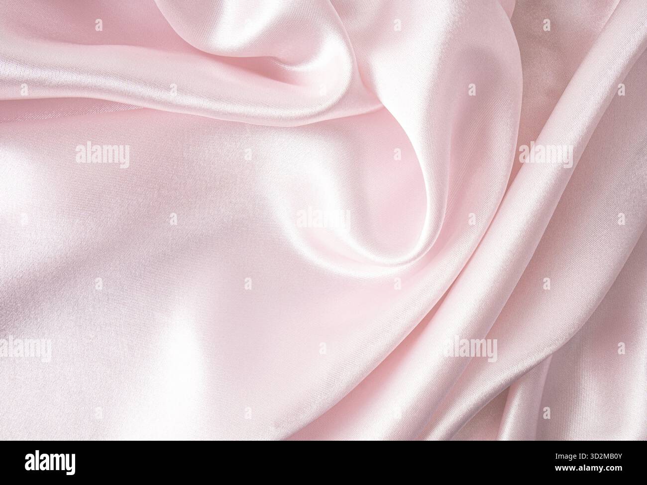 Elegante e delicato sfondo rosa in tessuto satinato. forme d'onda dei tessuti molli. festività, sfondo di nozze. Una copia dello spazio Foto Stock