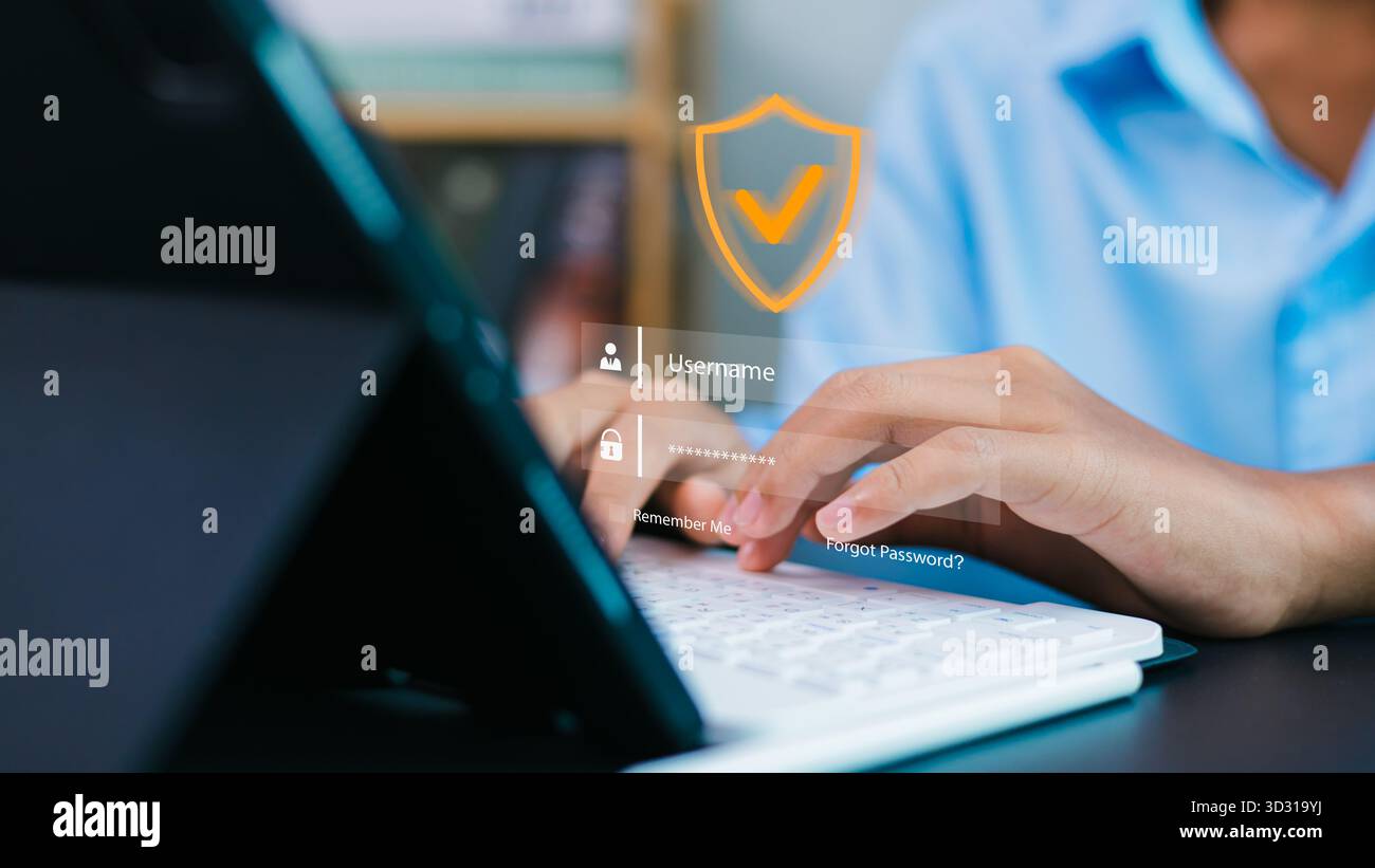 Digitazione utente sulla tastiera con interfaccia di accesso virtuale e icona di protezione. Concetto di sicurezza informatica, privacy online, protezione dei dati e protezione dei dati Foto Stock