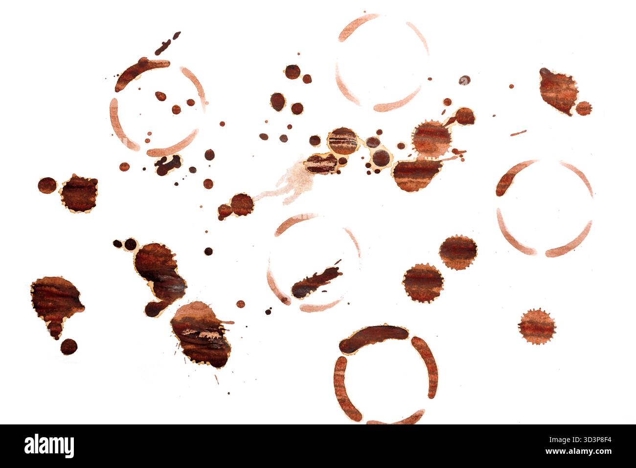 Varie macchie di caffè disposte in motivi astratti su sfondo bianco Foto Stock