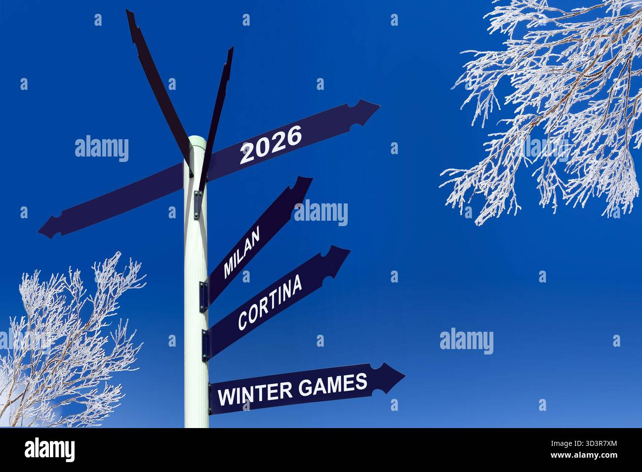 2026 Milano Cortina giochi invernali scritti su cartelli stradali, alberi innevati, celebrazioni delle olimpiadi invernali Foto Stock