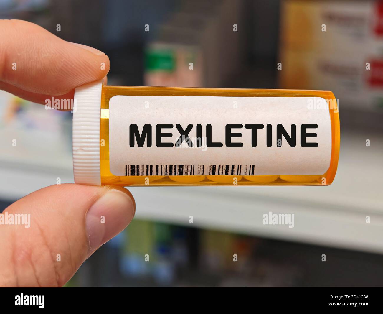 Scatola di plastica arancione di MEXILETINE compresse su un tavolo della farmacia ospedaliera usato per trattare i ritmi cardiaci irregolari e antiaritmici. Magazzino DELLA FARMACIA Foto Stock