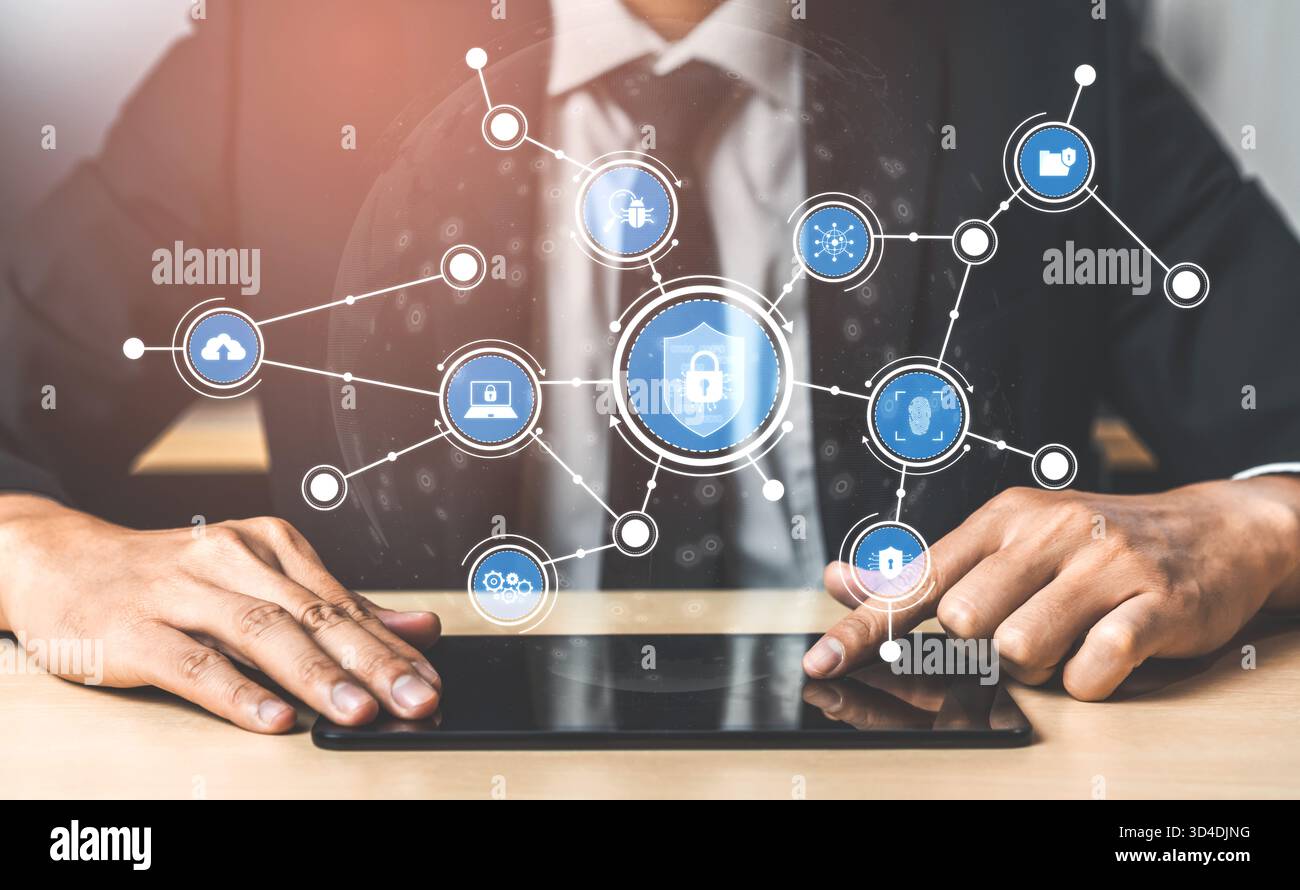 Un uomo d'affari professionista utilizza un tablet per analizzare le soluzioni di sicurezza dei dati, mostrando i sistemi di protezione digitale e la tecnologia moderna in un Foto Stock