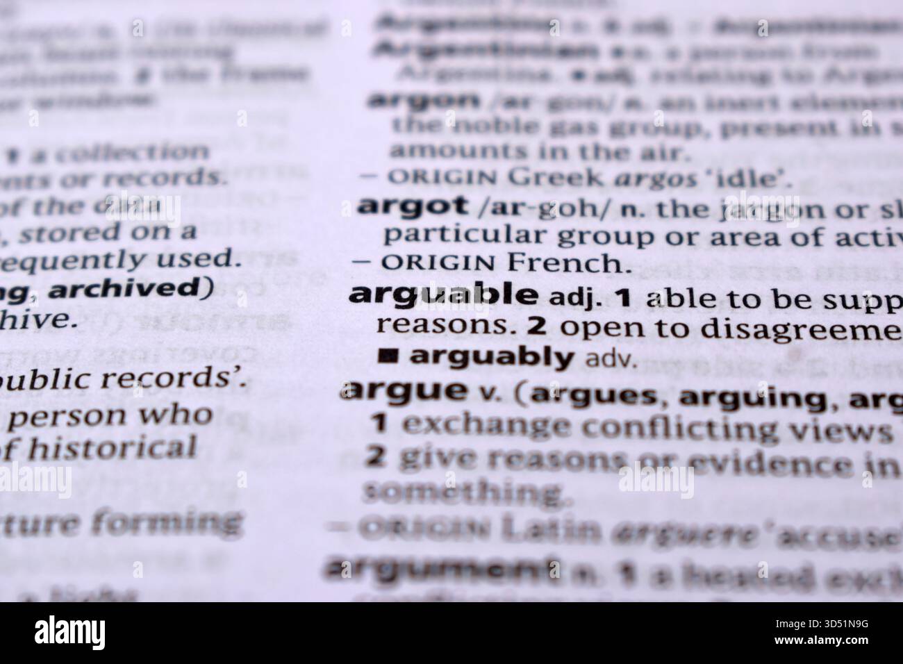 English Definition Dictionary pagina primo piano della parola stampata di -arguable Foto Stock