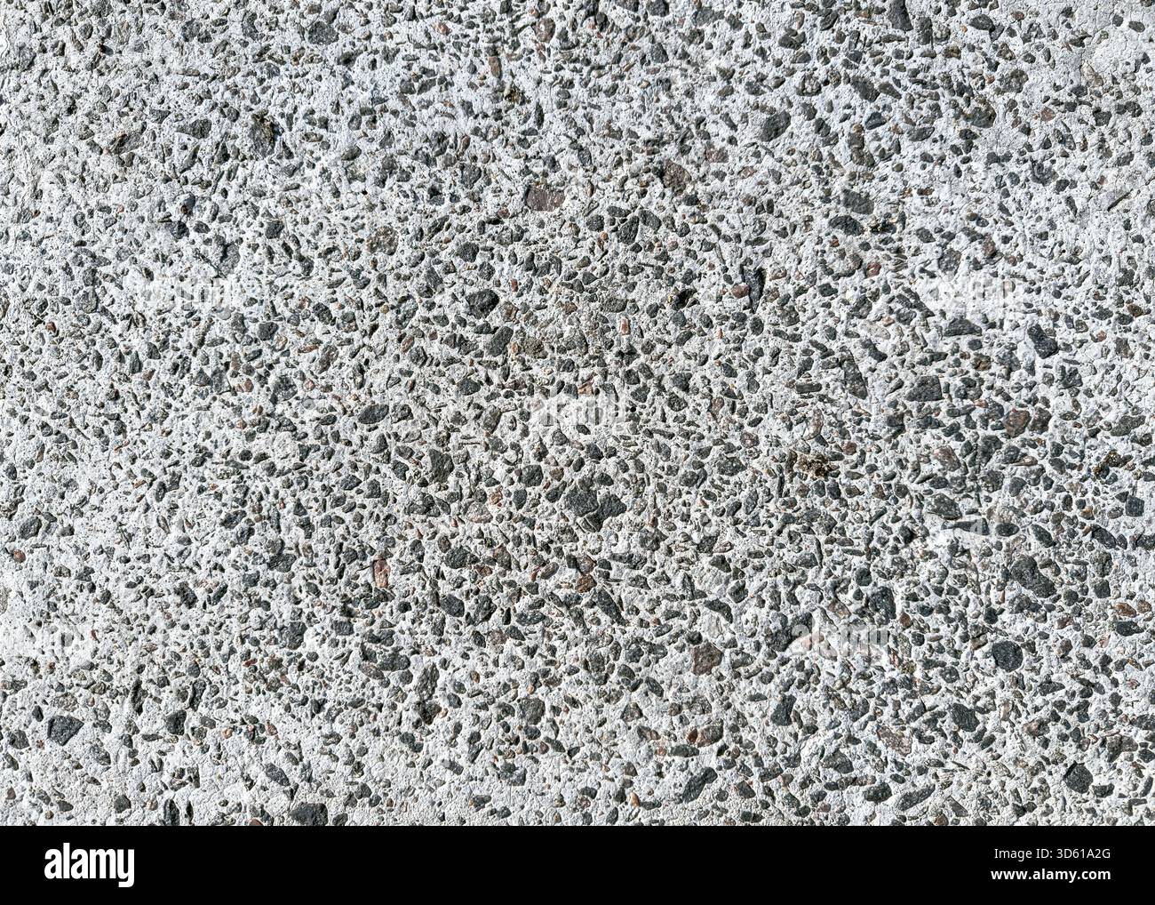pavimento in cemento sgranato con piccole pietre scure. sfondo di costruzione. alta risoluzione. Foto Stock
