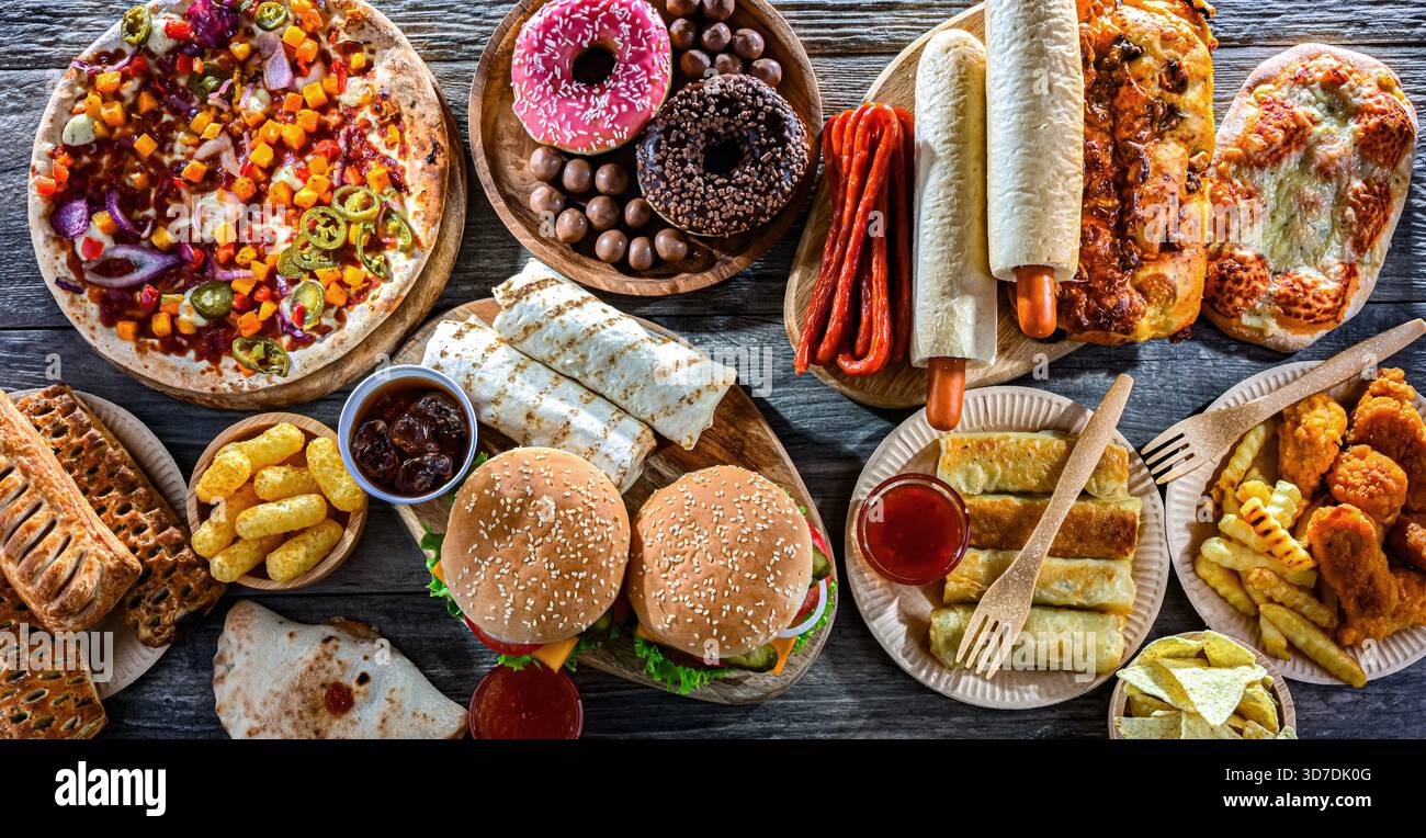 Alimenti che aumentano il rischio di cancro. Cibo spazzatura. Foto Stock