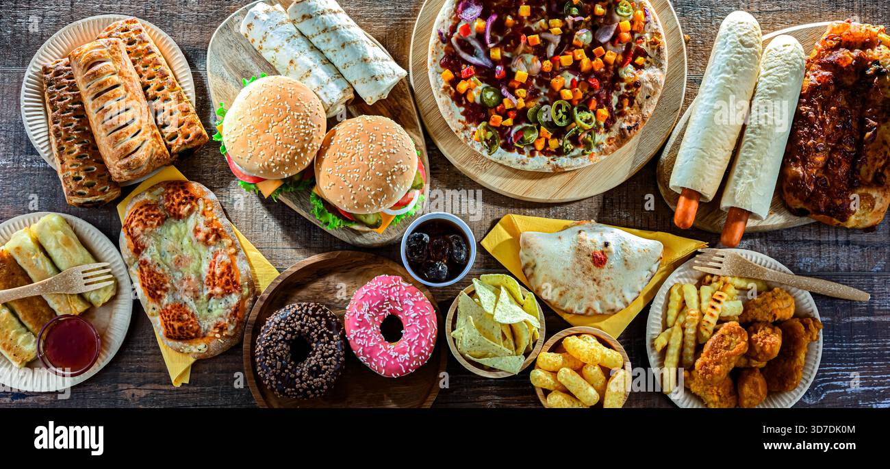Alimenti che aumentano il rischio di cancro. Cibo spazzatura. Foto Stock