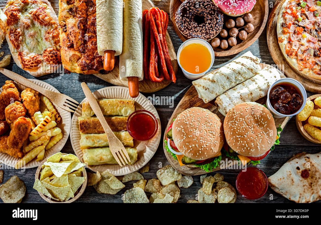 Alimenti che aumentano il rischio di cancro. Cibo spazzatura. Foto Stock