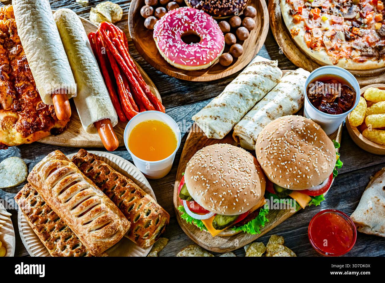 Alimenti che aumentano il rischio di cancro. Cibo spazzatura. Foto Stock