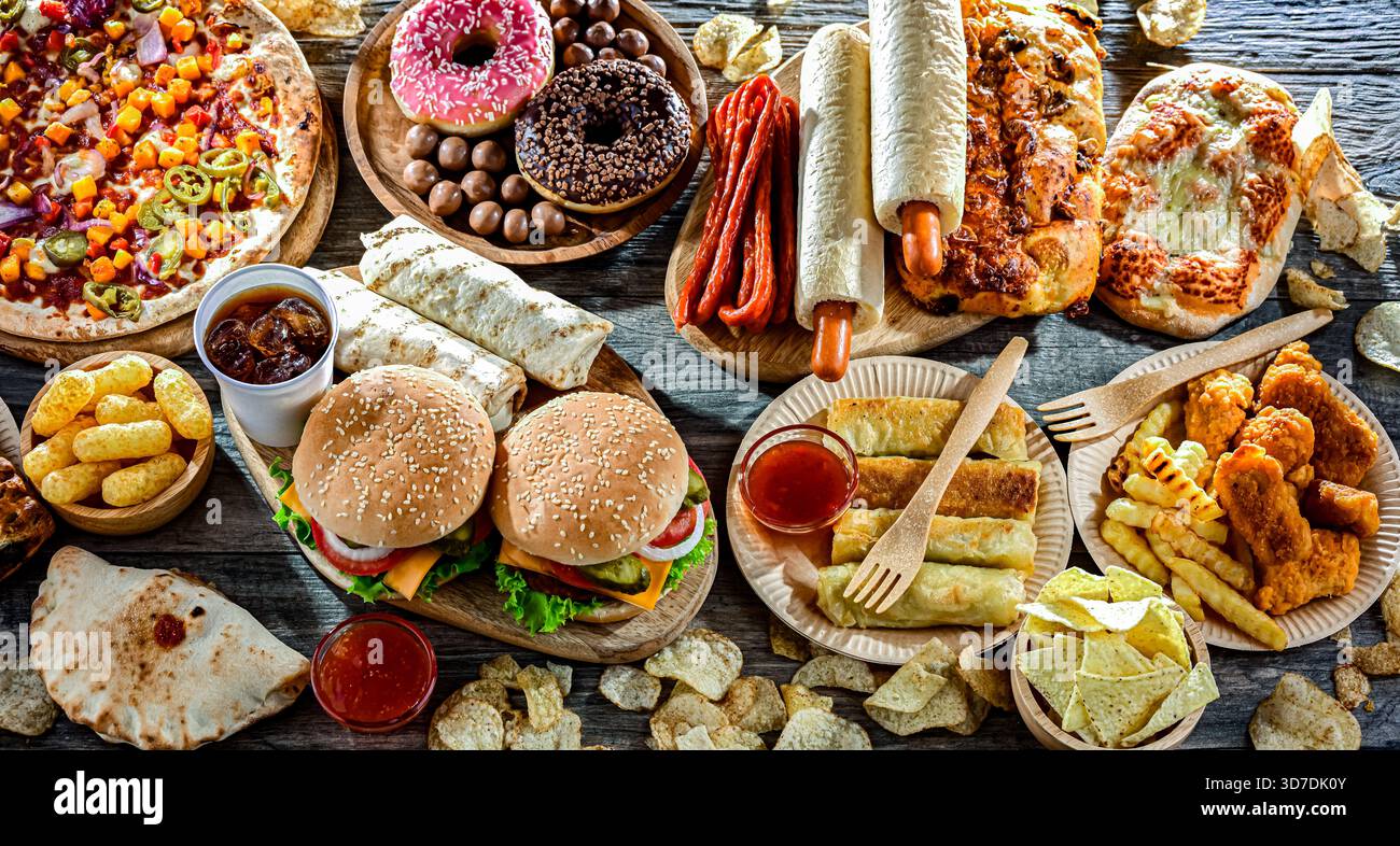 Alimenti che aumentano il rischio di cancro. Cibo spazzatura. Foto Stock