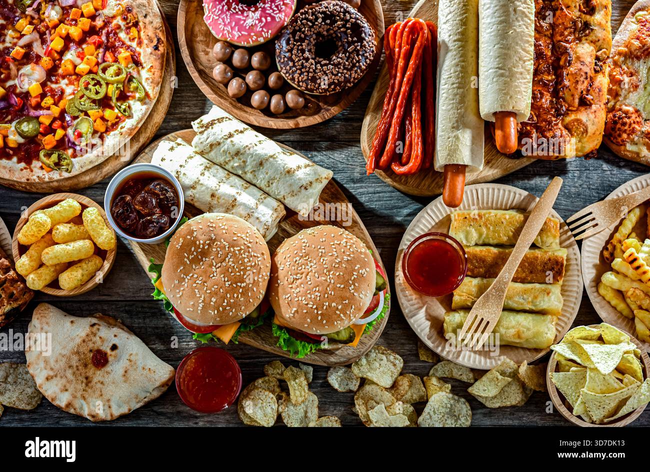 Alimenti che aumentano il rischio di cancro. Cibo spazzatura. Foto Stock