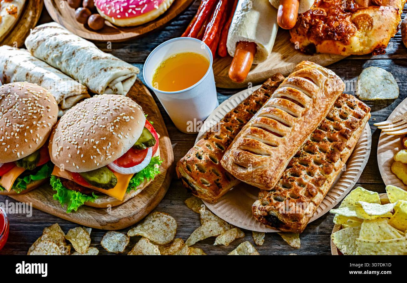 Alimenti che aumentano il rischio di cancro. Cibo spazzatura. Foto Stock