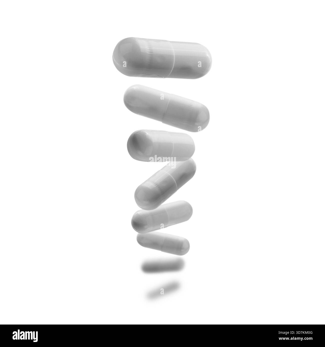 Capsule con il farmaco levitate su sfondo bianco. Foto Stock