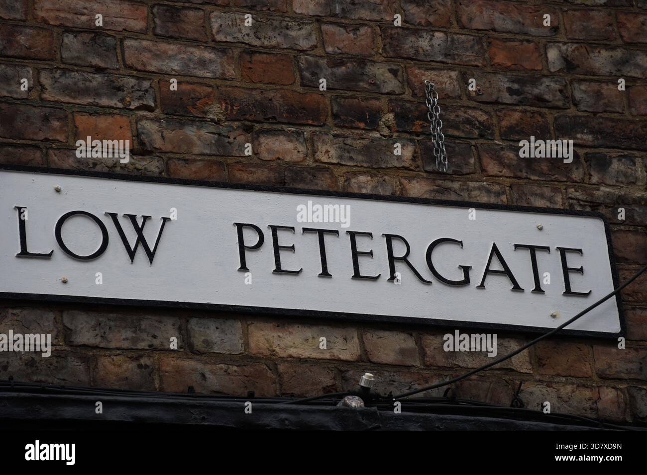 Cartello stradale per Low Petergate, York, Yorkshire, Inghilterra, Regno Unito Foto Stock