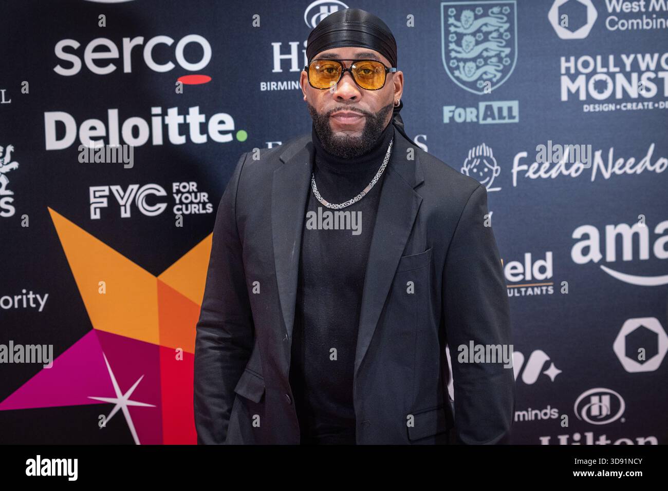 Kule T, membro del gruppo R&B MN8 degli anni '1990, partecipa ai MBCC Awards all'Hilton Birmingham Metropole, Birmingham, Regno Unito. Foto Stock