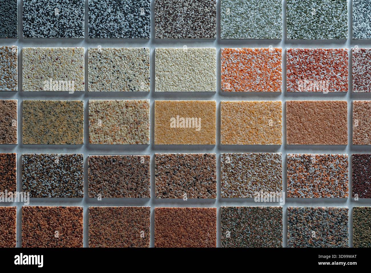 Esempi di gesso multicolore per la decorazione della facciata e degli interni degli edifici, tavolozza di colori. Presentazione dei materiali da costruzione sul retro Foto Stock