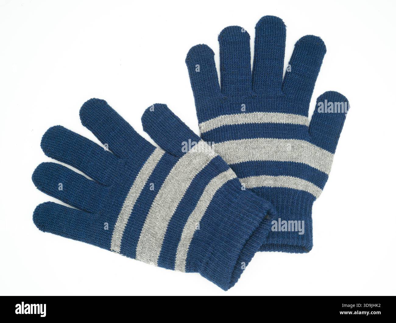 Un paio di guanti in maglia economici prodotti in serie. Foto Stock