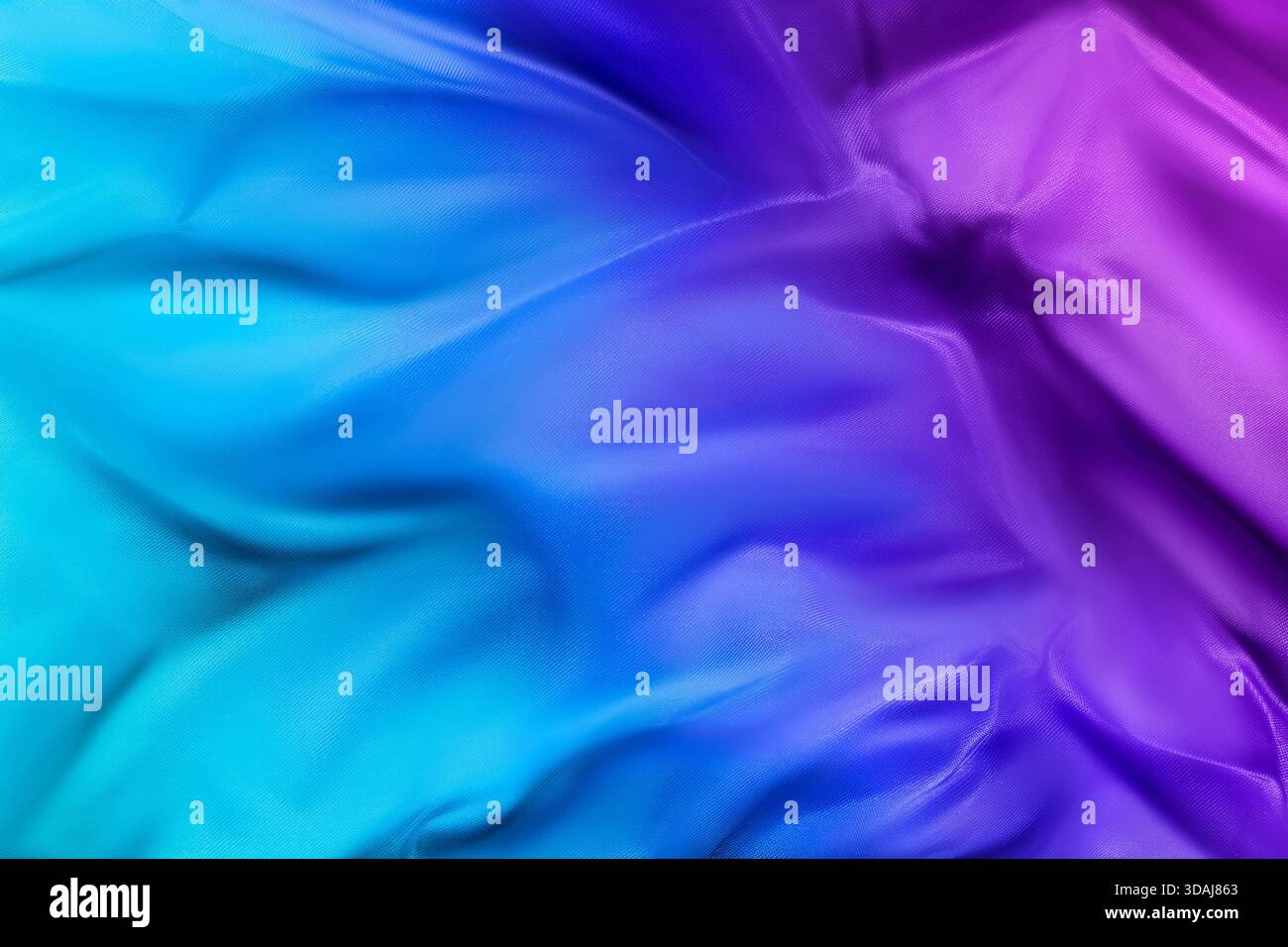 Tessuto di seta blu ombre e viola come sfondo astratto Foto Stock