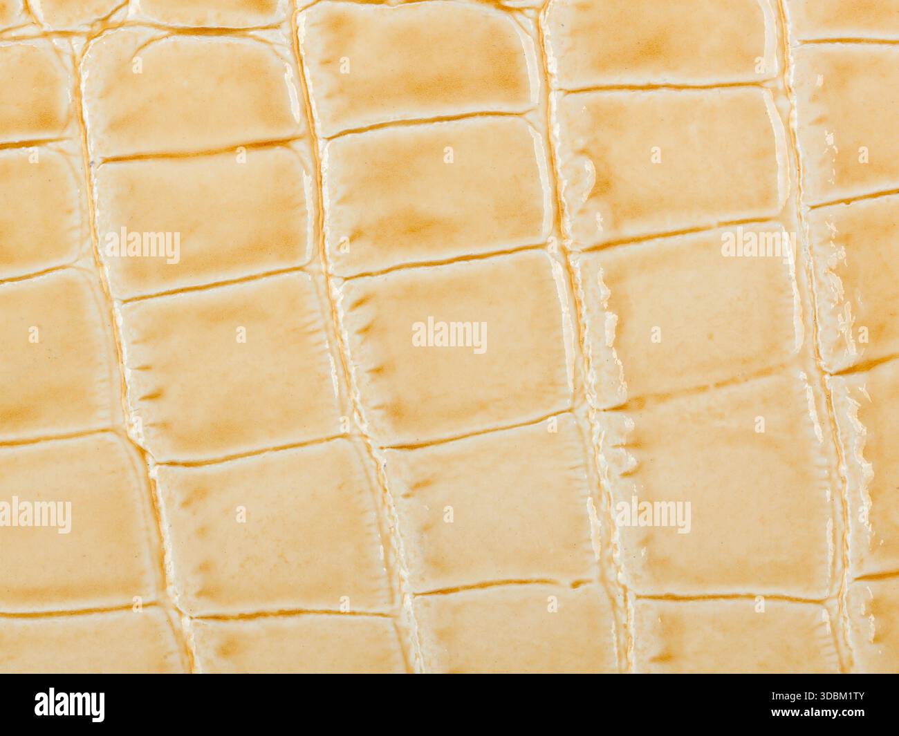 Abstract texture della pelle sintetica, sfondo beige. Foto Stock