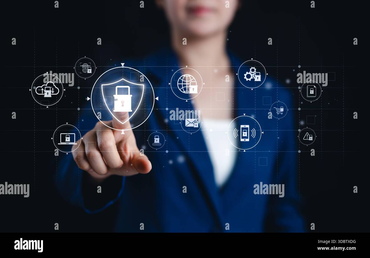 Concetti di cibersicurezza e autenticazione digitale. Una donna d'affari interagisce con le icone della cybersicurezza, la protezione dei dati, l'autenticazione, la crittografia, la sicurezza Foto Stock