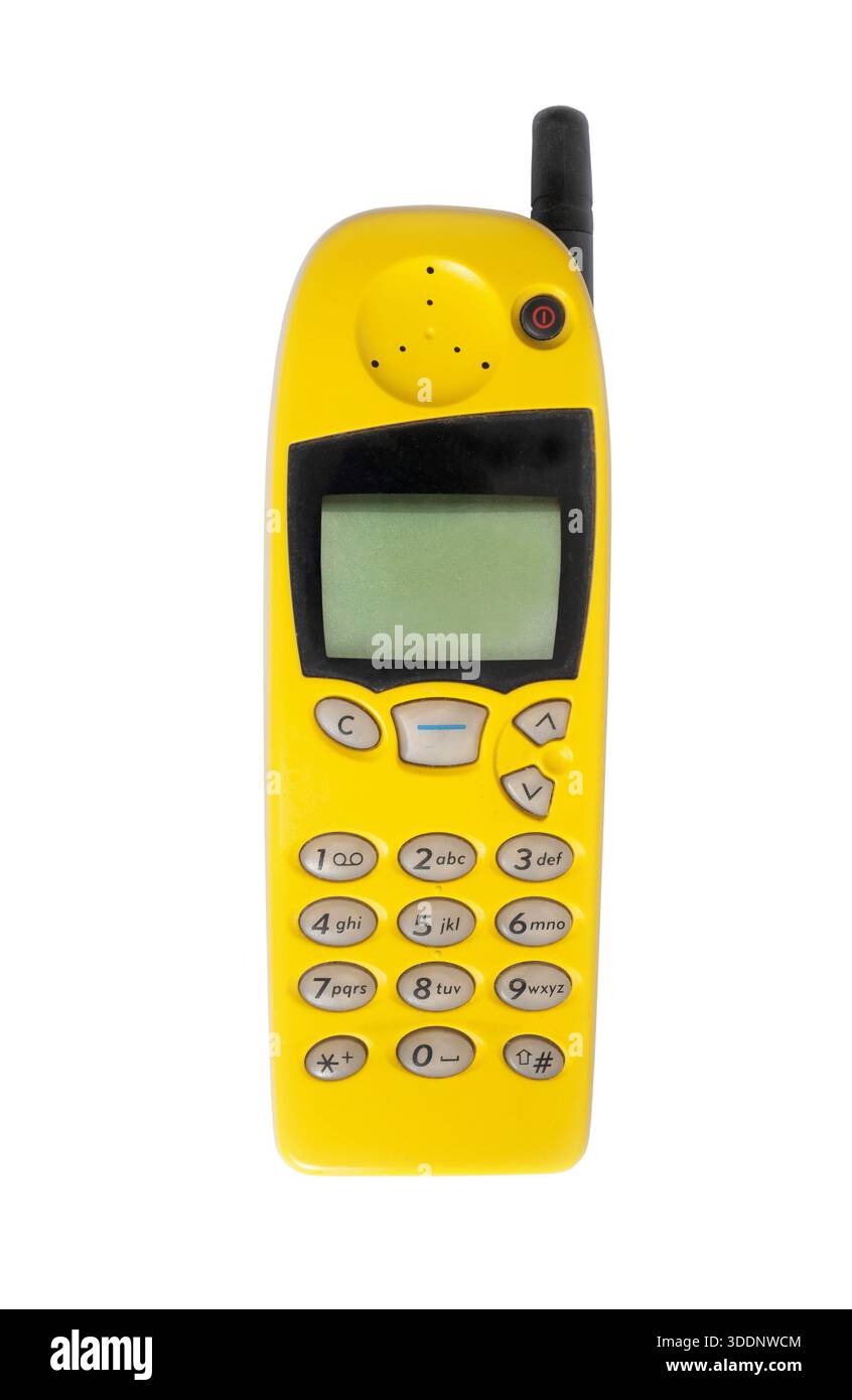 Vecchio cellulare giallo isolato su sfondo bianco, cellulare vintage Foto Stock