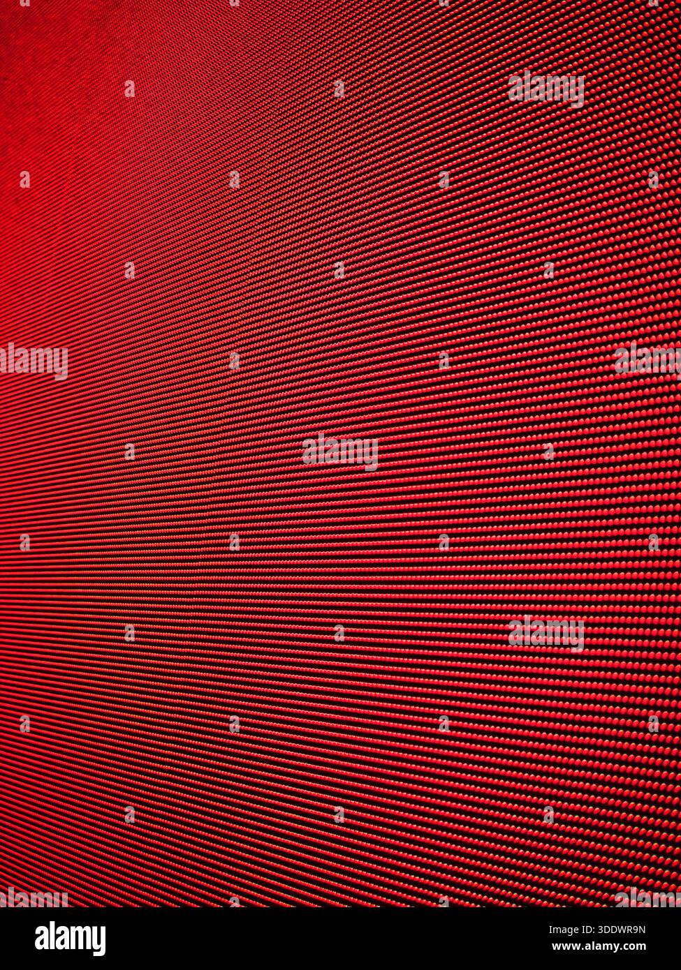 Primo piano del display a LED rosso. Sfondo a matrice digitale astratto con pixel rossi vivaci, trama di un grande video wall. Foto Stock