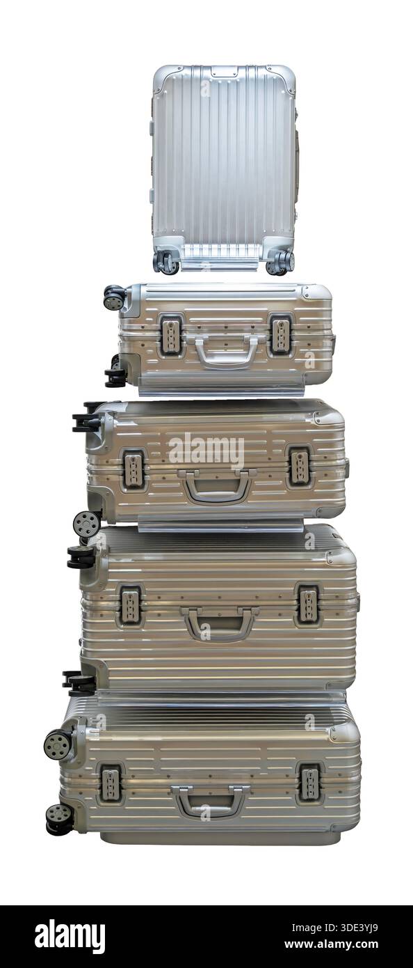 una pila verticale di valigie a guscio rigido con chiusure nere e manici argentati. Le valigie sono disposte in ordine decrescente di dimensioni, con l'sma Foto Stock