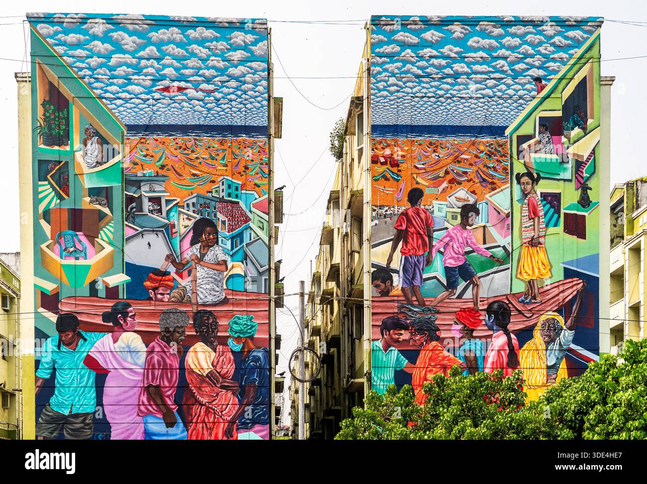 Colorato murale urbano che raffigura persone diverse e paesaggi urbani. Foto Stock