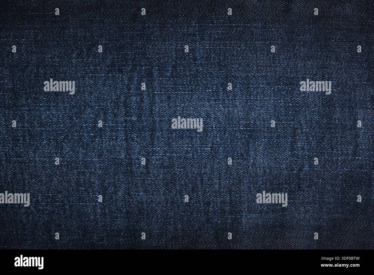 Jeans in denim texture o sfondo jeans in denim. Tessuto jeans blu scuro Foto Stock