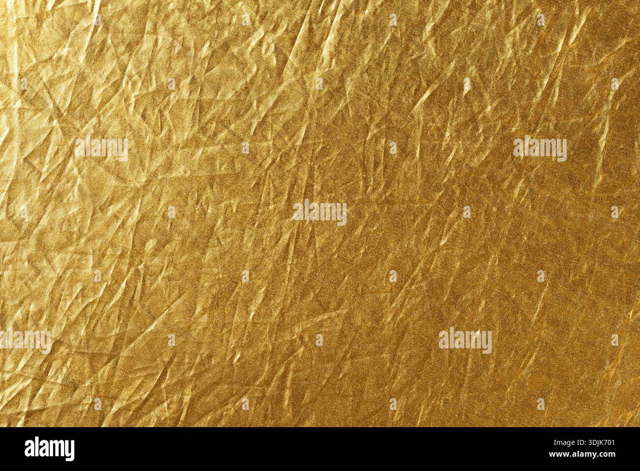 Struttura in lamina dorata per sfondo e design. Sfondo astratto e trama per il design Foto Stock