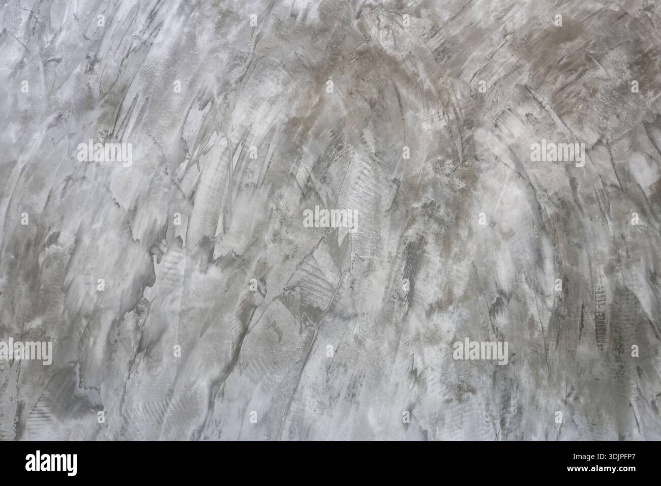 La struttura grigia delle pareti in cemento lucido con superficie in rilievo e grunge crea uno sfondo industriale grezzo e dettagli astratti per un design moderno Foto Stock