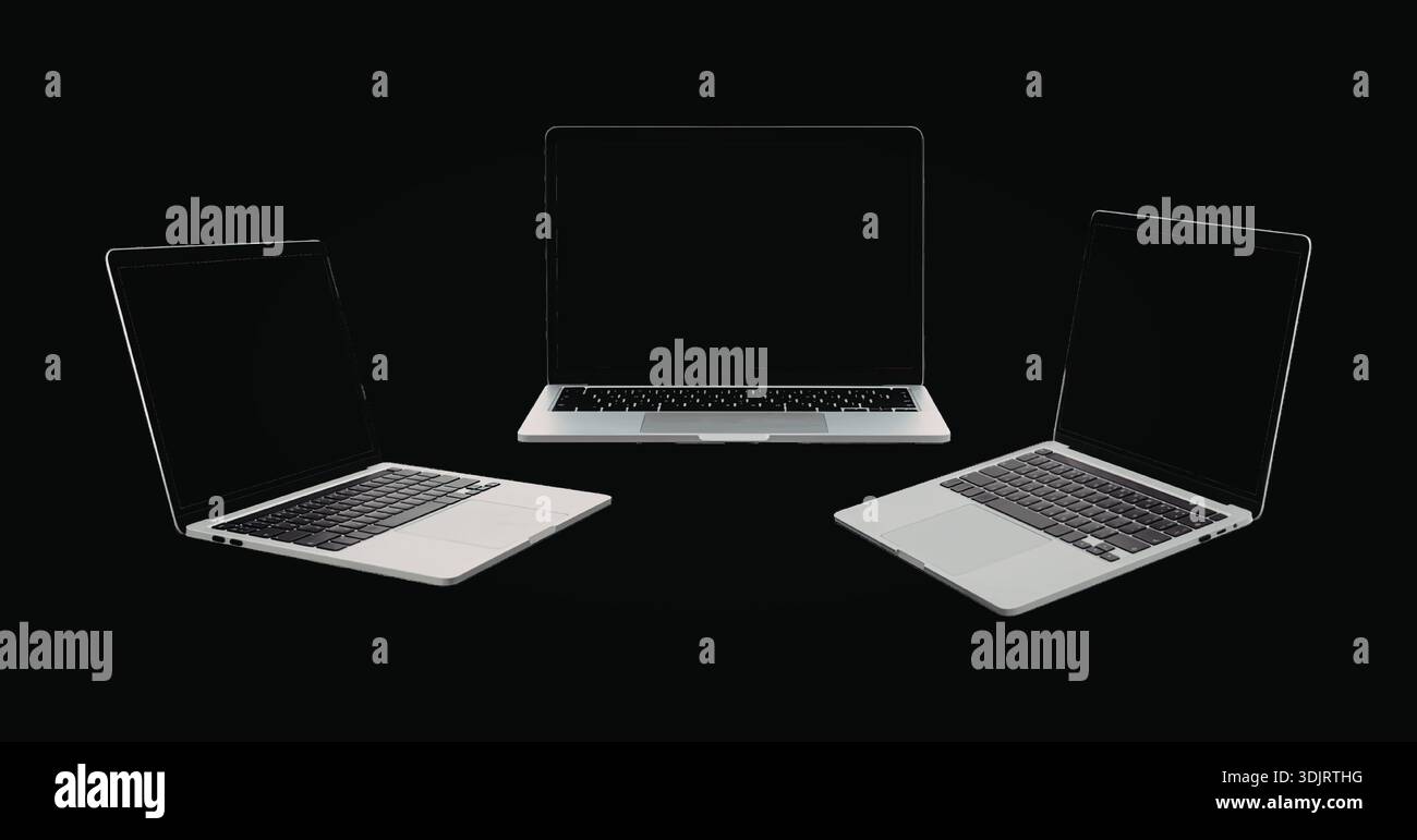 Immagine monocromatica con tre laptop visualizzati in varie angolazioni su sfondo nero. Foto Stock