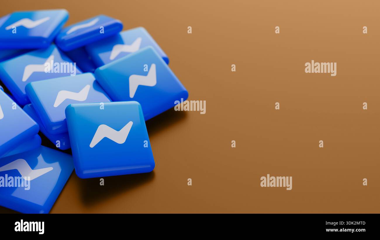 Primo piano del logo del servizio di messaggistica di Facebook Messenger in una pila su sfondo bronzo con spazio di copia come intestazione banner Web Foto Stock