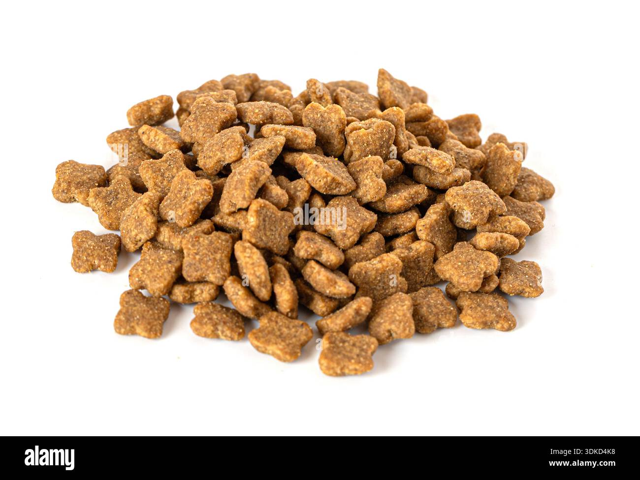 Cibo per animali domestici kibble a forma di croce che fornisce alimentazione animale Foto Stock