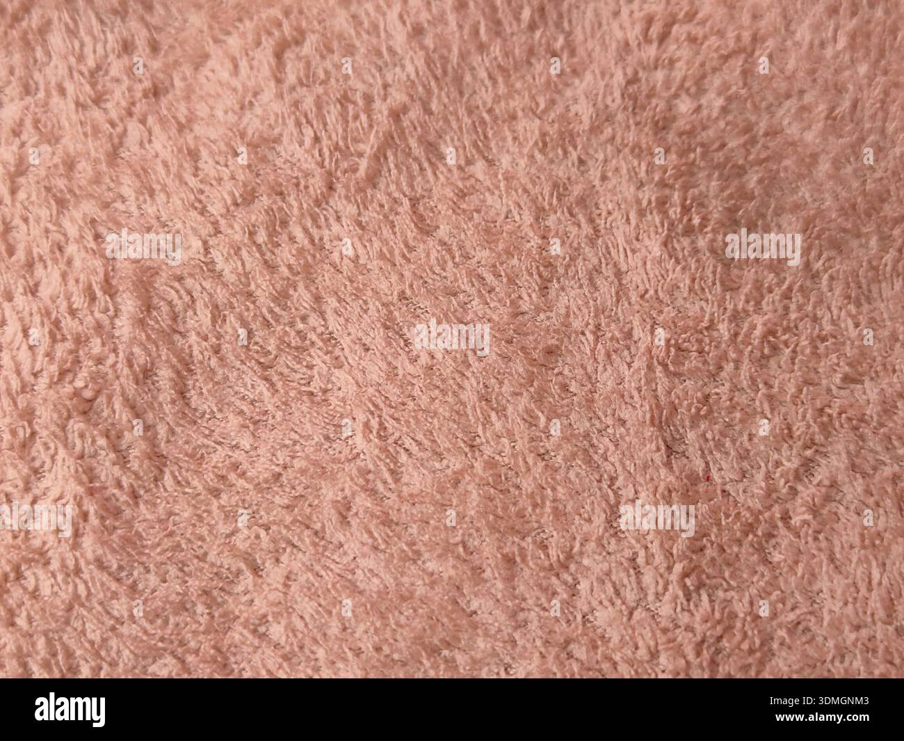 Si tratta di un primo piano di un tessuto morbido, rosa, squallido, probabilmente un tappeto, una coperta, o tessuto. Foto Stock
