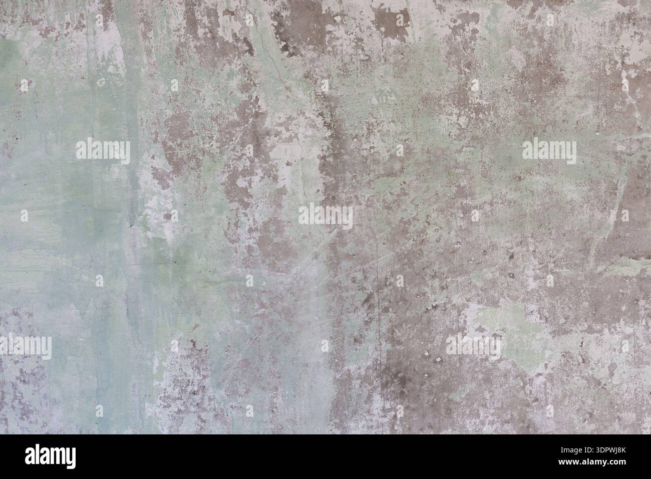 Superficie della parete che mostra ripetizioni e trame in sfumature di verde e grigio Foto Stock