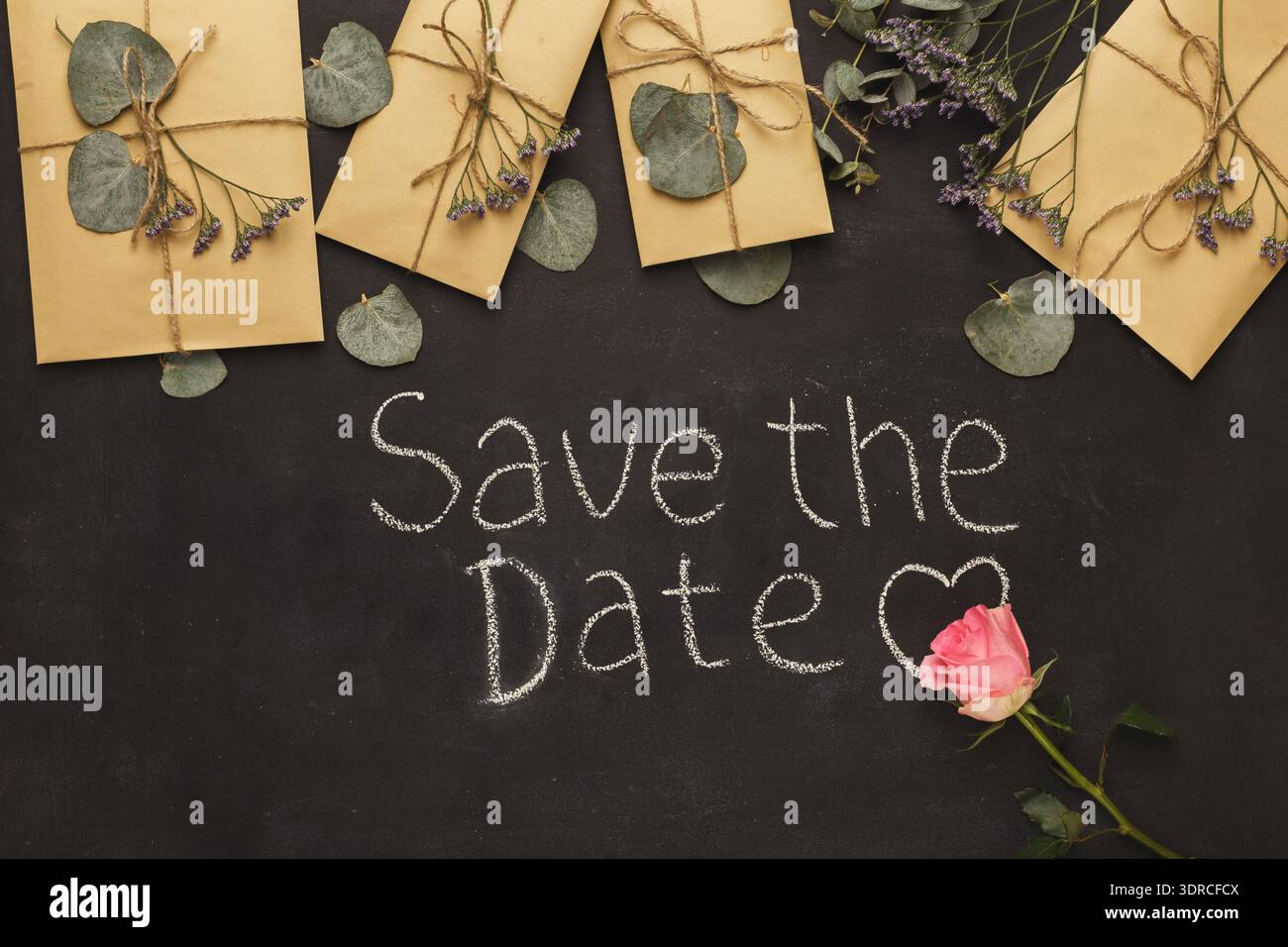 Collage di Save the Date Cards with Flowers on a Chalkboard Surface Foto Stock