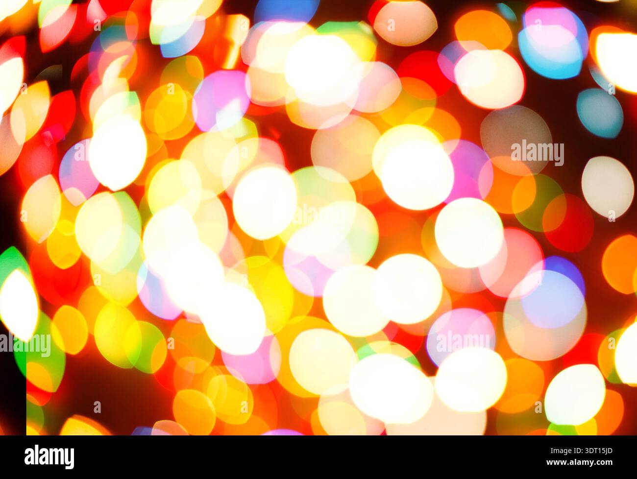 Colorato collage di cerchi di luce in un design a mosaico che crea un display visivo accattivante Foto Stock