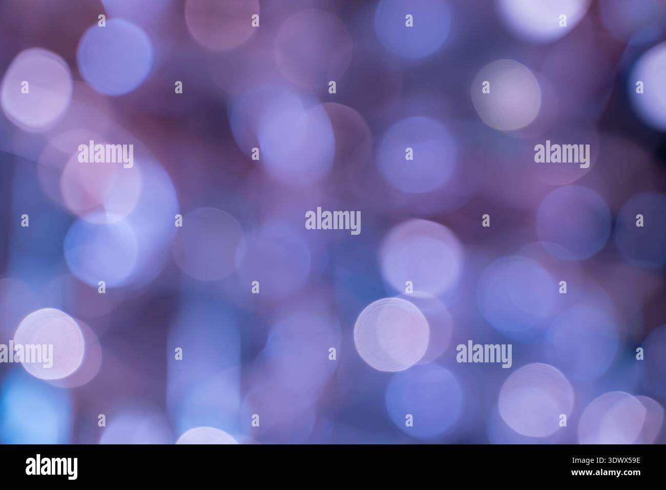 Morbido effetto bokeh con cerchi luminosi di luce che offrono uno sfondo elegante e suggestivo per una grafica creativa. Foto Stock