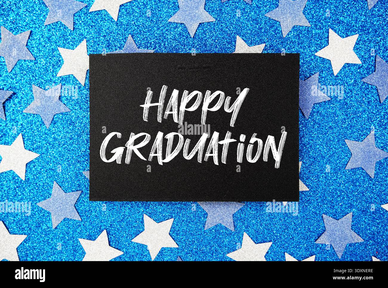 Happy Graduation Card su sfondo Blue Glitter Star Foto Stock