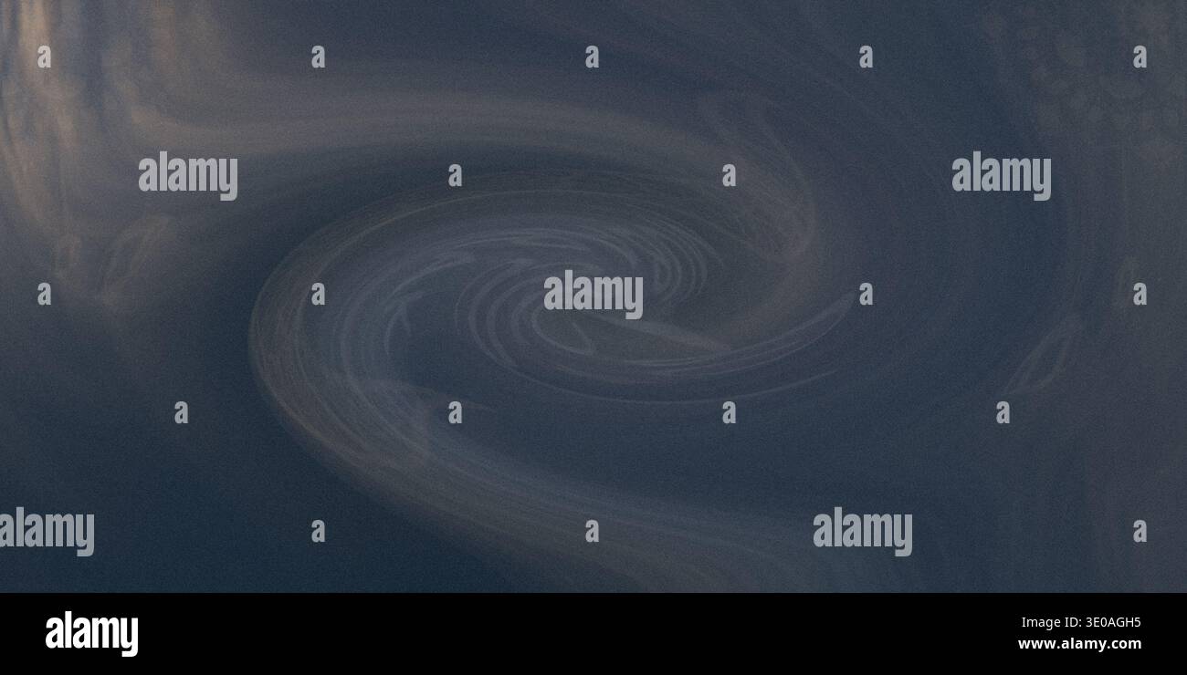 Sfondo astratto blu scuro con un motivo vorticoso e sfumatura morbida, che crea un senso di mistero e intrigo Foto Stock