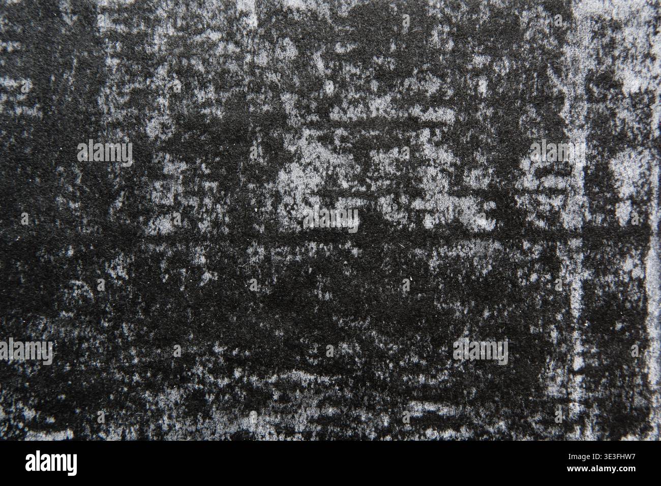 Primo piano di carta nera in rilievo con superficie originale usurata Foto Stock