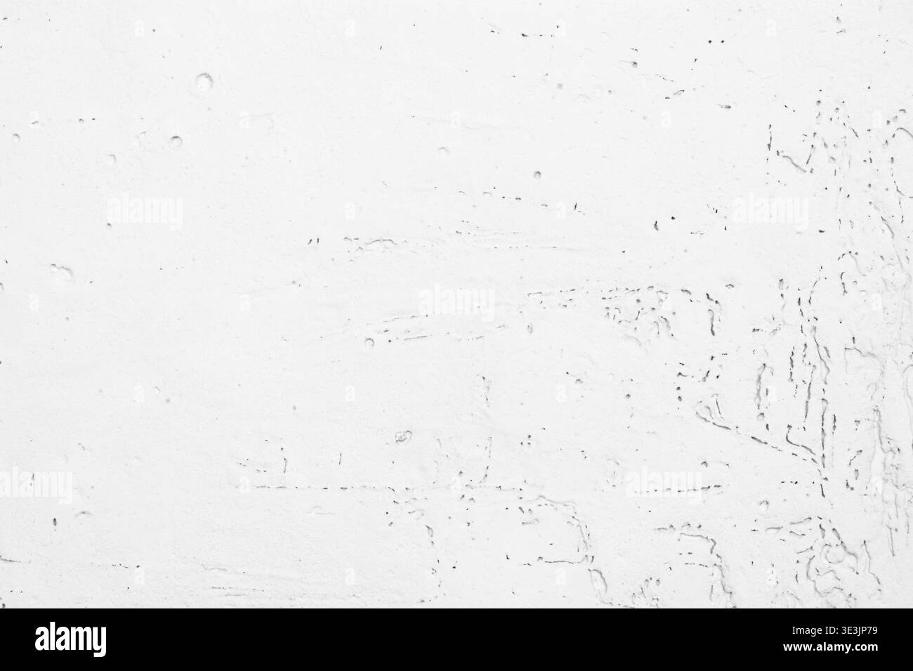 Pareti in stucco bianco con sottili crepe e piccoli fori porosi Foto Stock