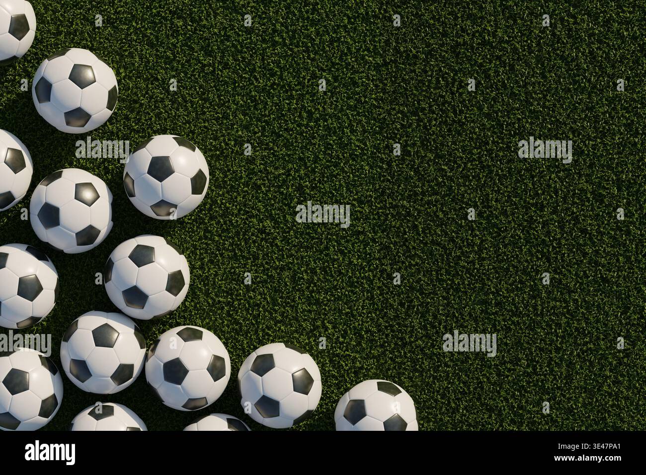 Un mucchio di palline da calcio su un campo di erba verde Foto Stock