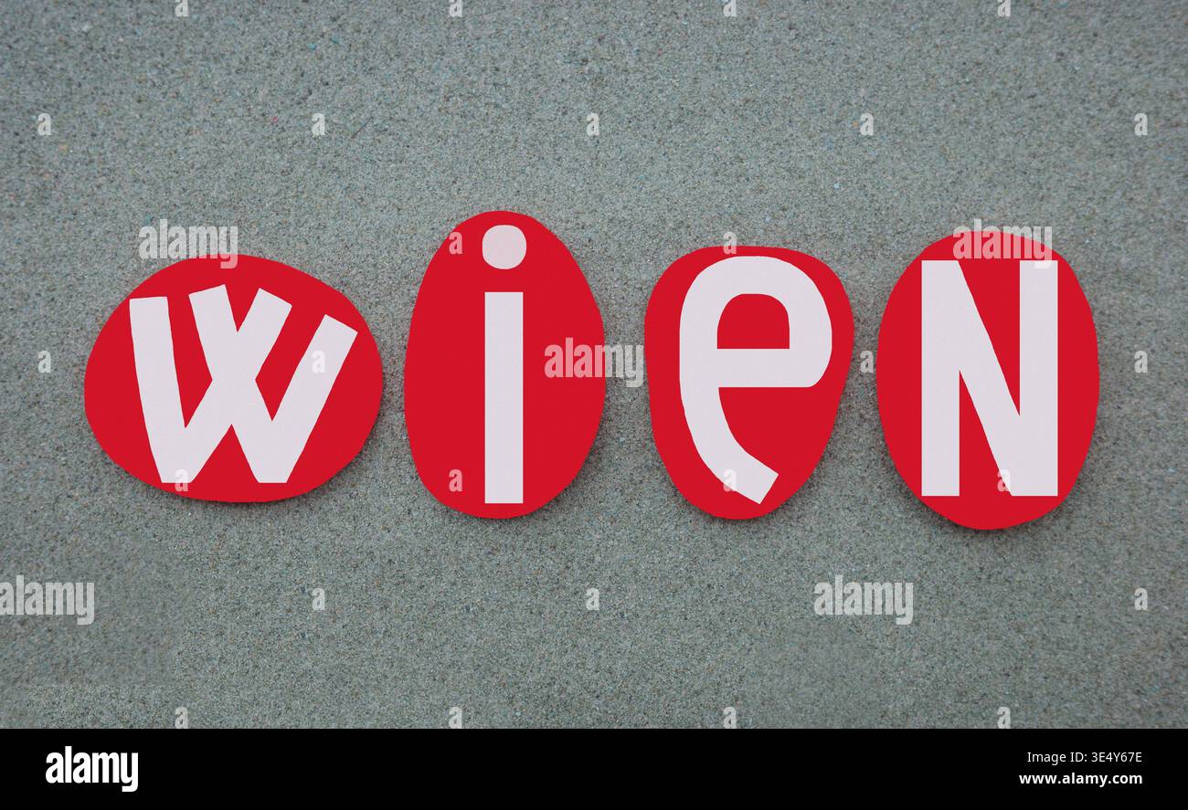 Vienna, capitale dell'Austria, nome creativo composto con lettere di pietra rossa dipinte a mano su sabbia verde per un logo, poster, banner unico Foto Stock