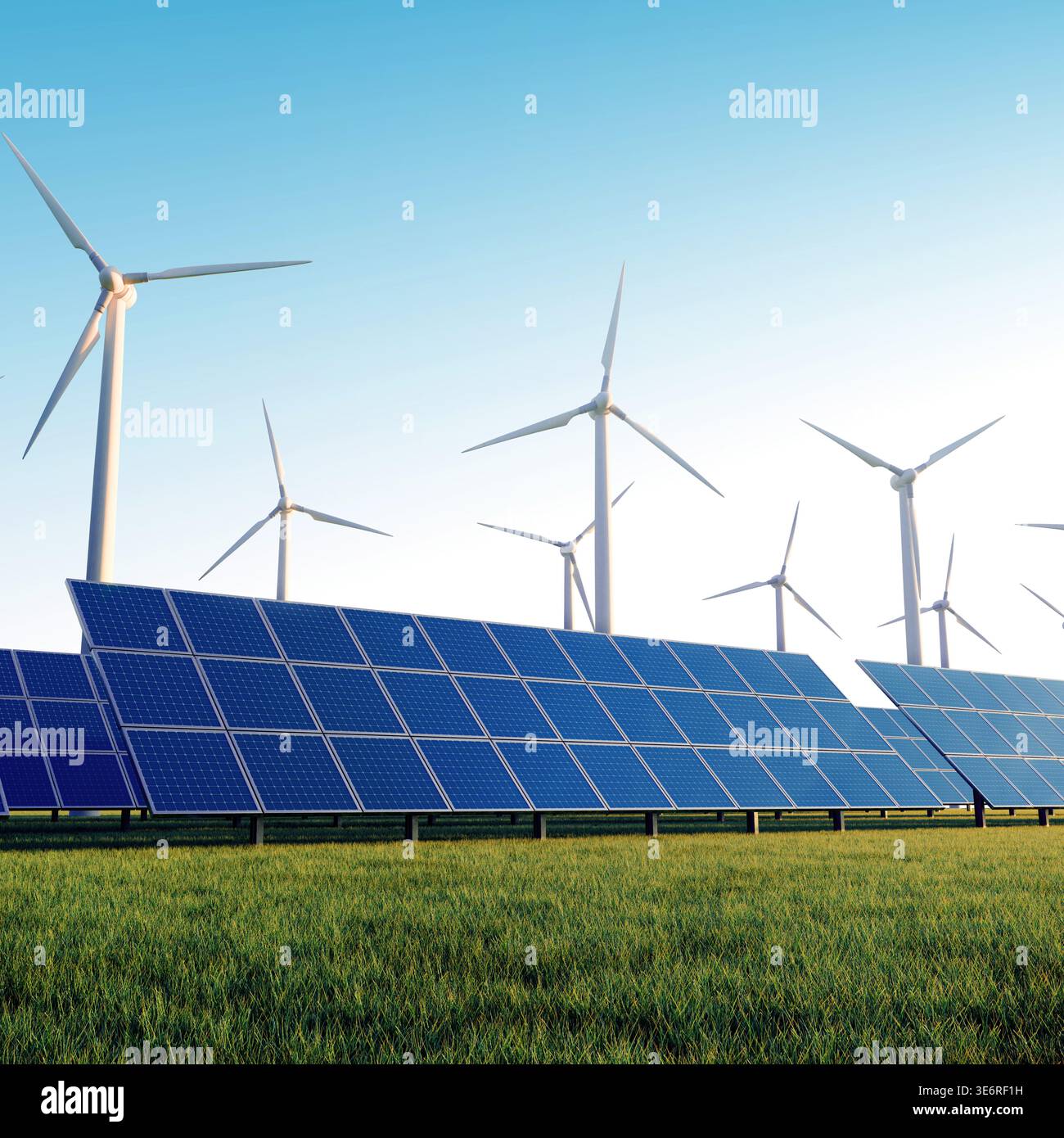 Pannelli solari e turbine eoliche su un campo verde sotto un cielo azzurro. Concetto di energia rinnovabile, energia sostenibile e tecnologia verde. Foto Stock