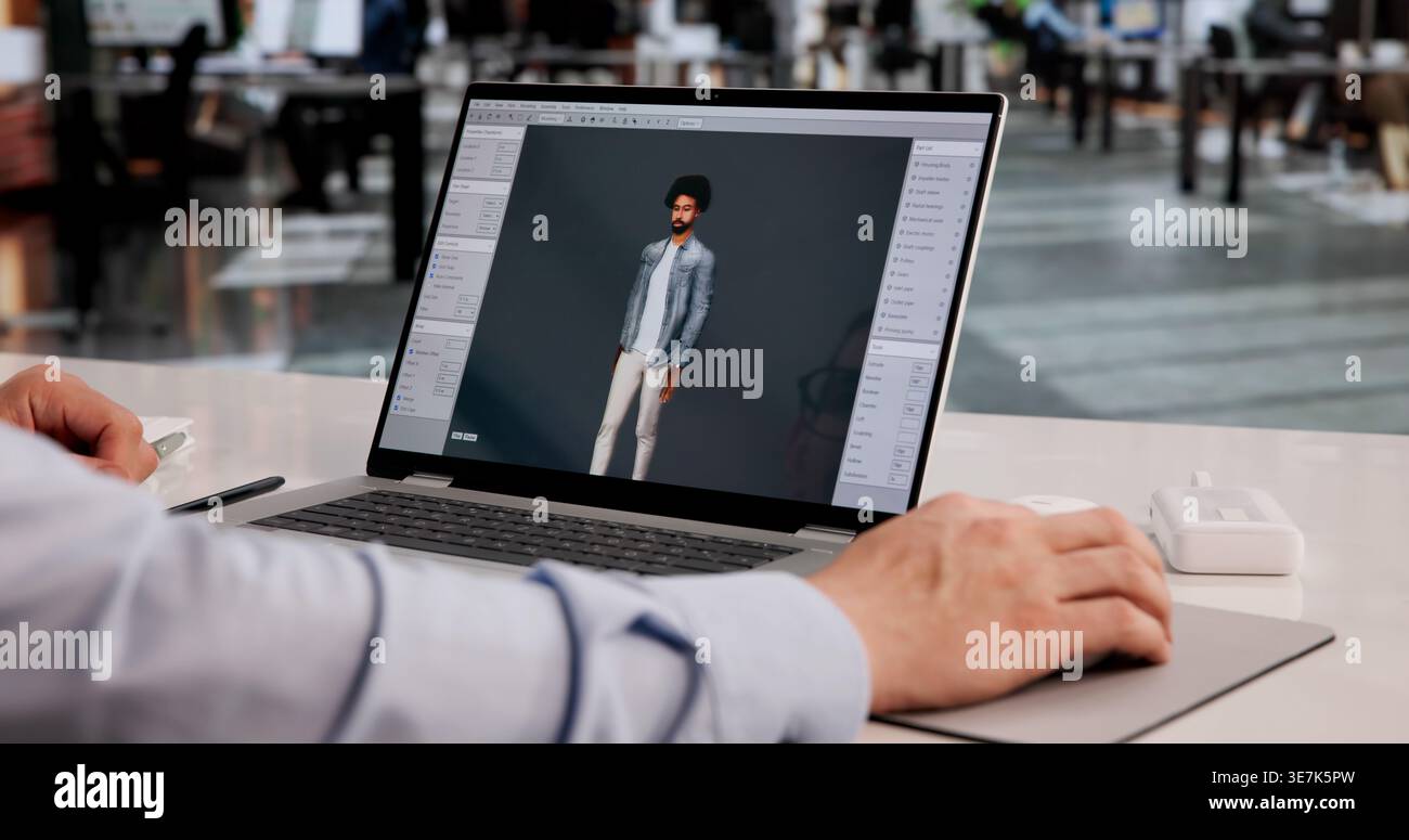 L'artista 3D crea con abilità intricate animazioni di personaggi utilizzando laptop per progetti creativi Foto Stock