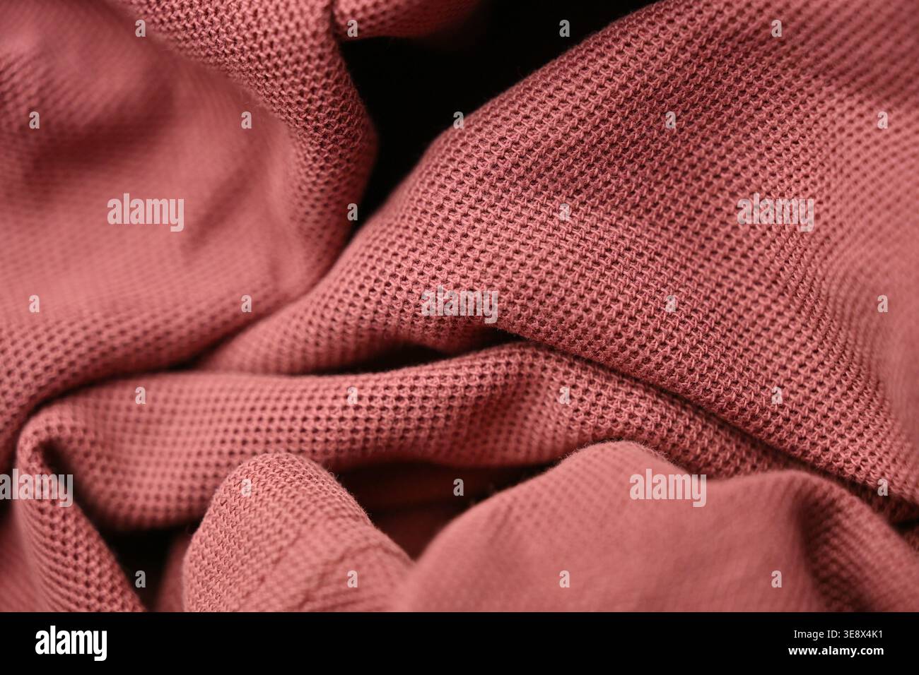 Tessuto T-shirt rosa chiaro - primo piano con sfumature macro e morbidi sfondi sfocati Foto Stock