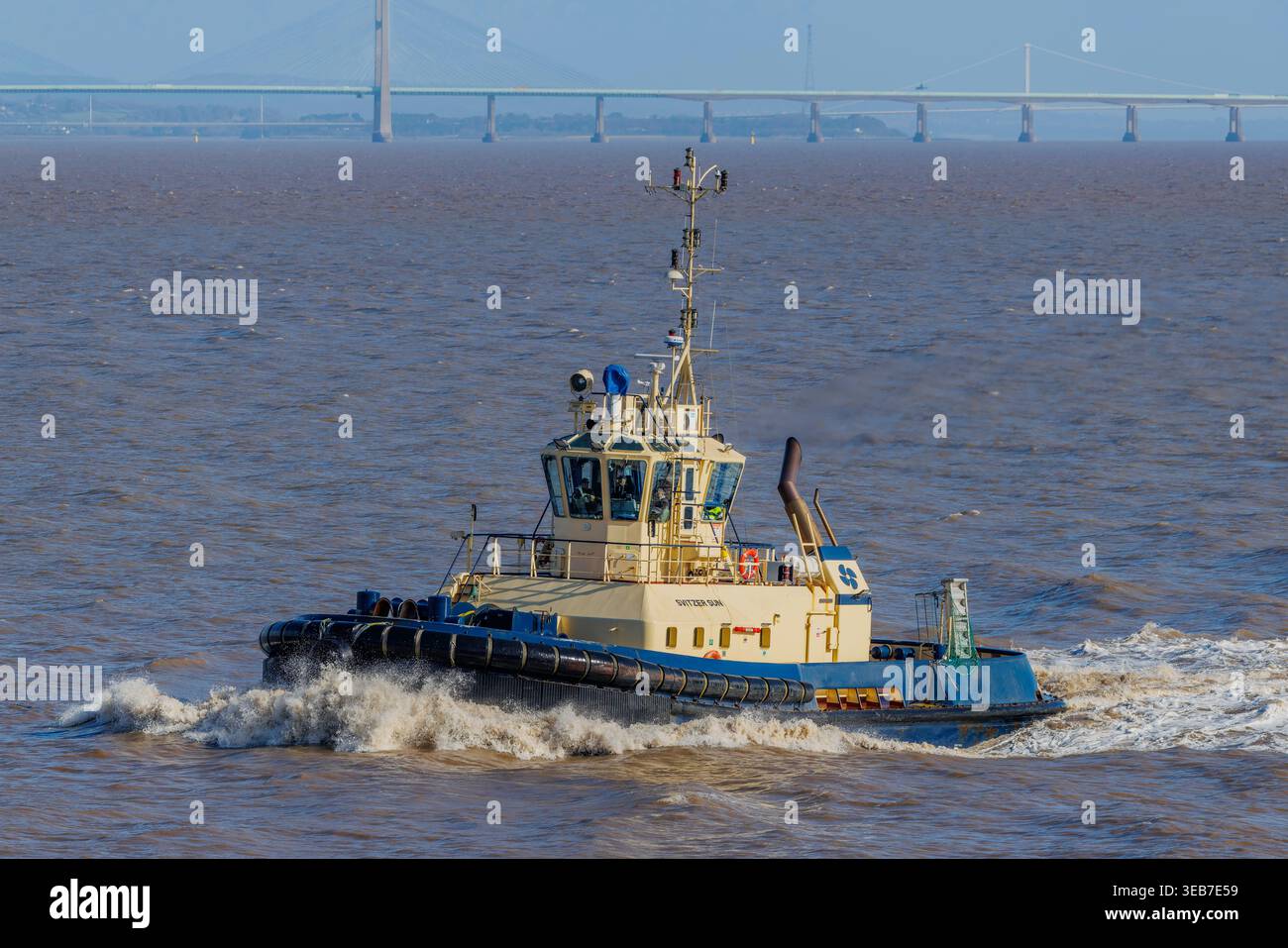 Tug facendo onde Foto Stock