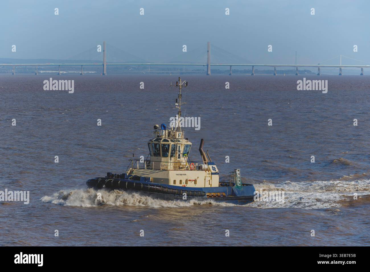 Tug facendo onde Foto Stock