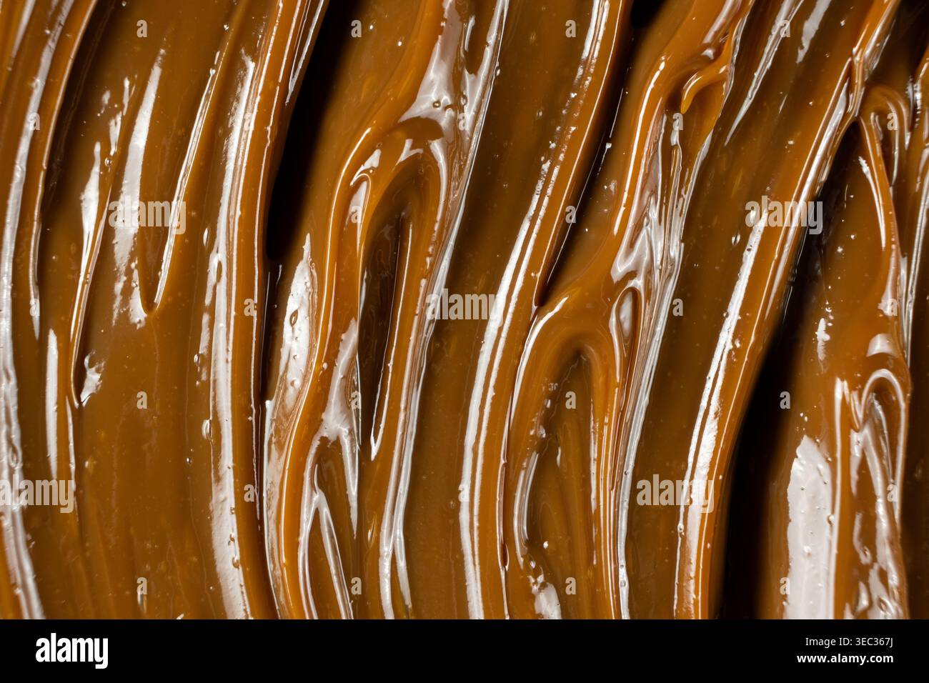 Ricca consistenza di caramello marrone dorato per la progettazione di alimenti Foto Stock